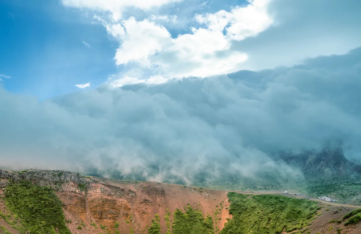 Misty Clouds Over Rocky Mountains